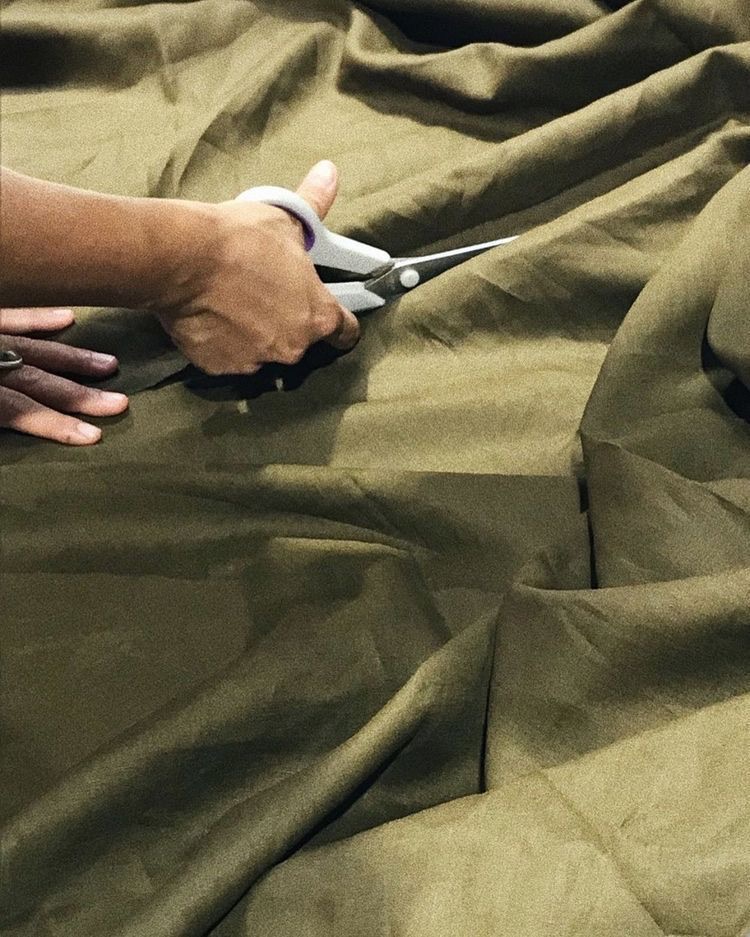 Cutting the linen blend by hand